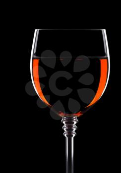 wine in glass isolated on black background