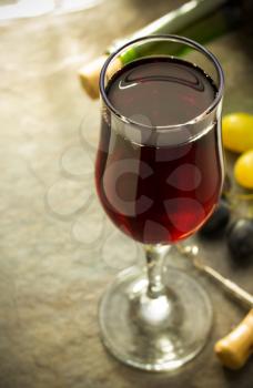 wine glass and grapes on table