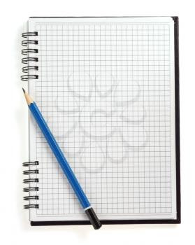 pencil on checked notebook isolated on white background