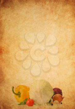 healthy vegetable food on old paper parchment background texture