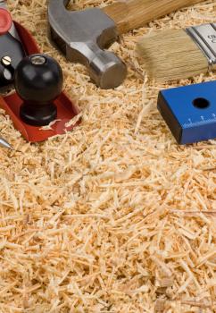 set of tools and instruments on wooden sawdust