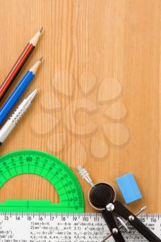 school accessories and supplies on wooden background texture