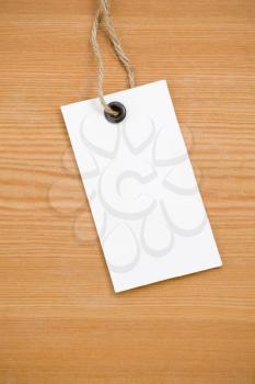 price tag on wooden board background