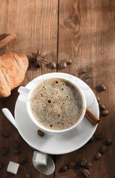 cup of coffee on wooden background