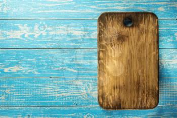 cutting board at wooden table