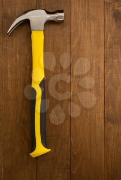 hammer tool on wooden background