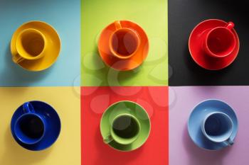cup and saucer at abstract colorful background