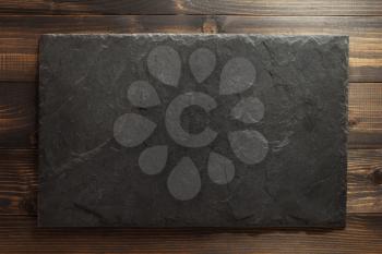 slate texture at wooden background