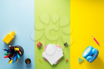 school supplies at abstract colorful background texture