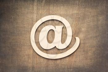 email wooden symbol at old background, top view