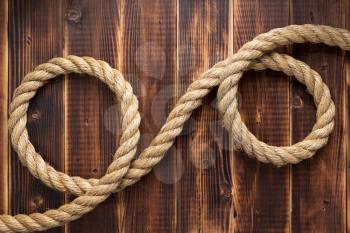 ship rope at wooden background, plank board texture