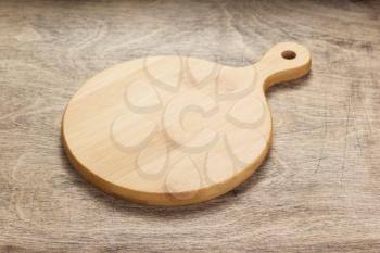 cutting board at wooden  table background
