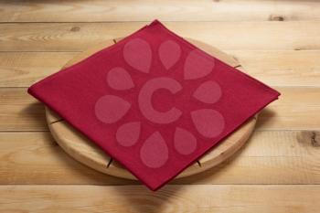 pizza cutting board at rustic wooden table in front plank background