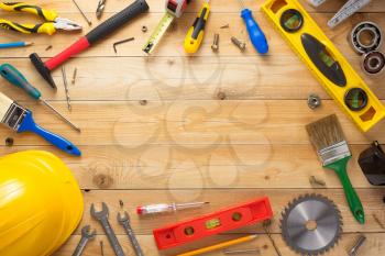 set of tools and instruments at wooden surface background