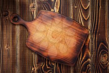 cutting board or tray at wooden background texture, top view