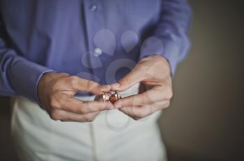 Wedding rings in hands.