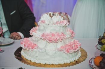 Pie with roses on wedding.