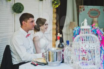 The bride and groom at the table.