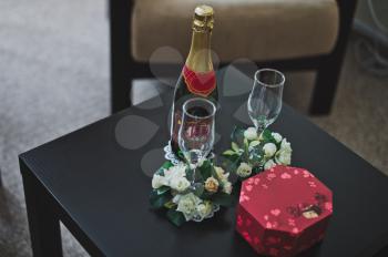 Table with champagne glasses and chocolates.