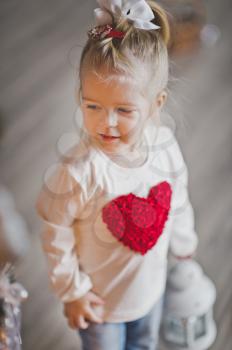Child with heart on chest.
