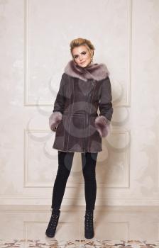 Advertising stylish and beautiful models of winter womens clothing.