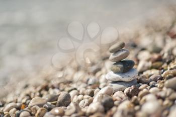 The pyramid of pebbles on the beach.
