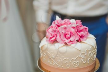 Wedding cake three tier with flowers.