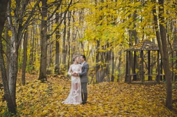 The couple in the autumn forest.