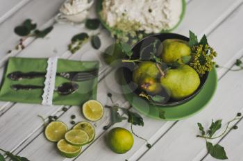 Photo of lemons and pears on the dining table.