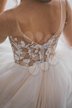 Photo of a free light wedding dress on the bride.