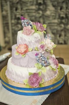 Unusual wedding cake in three tiers.