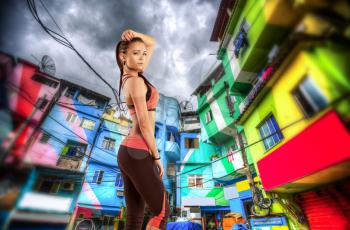girl athlete .Colorful painted buildings of Favela  in Rio de Janeiro Brazil