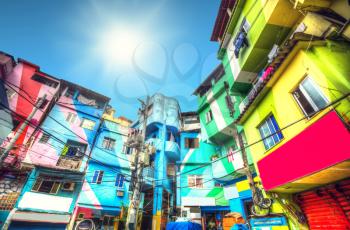 the sun is shining. Colorful painted buildings of Favela  in Rio de Janeiro Brazil