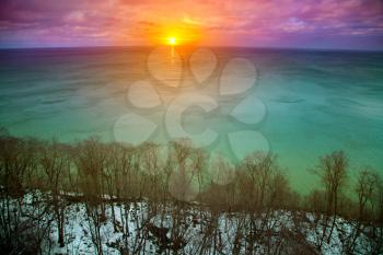 colorful sunset over the sea winter. view from above. spring is coming