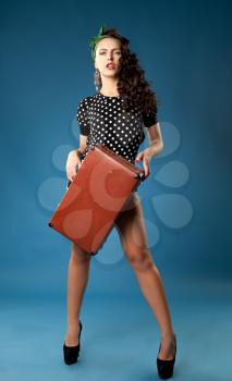 pin-up girl. beautiful young woman isolated on white in studio in old fashion clothes representing pinup and retro style