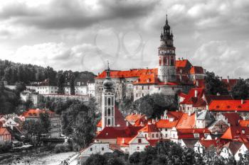 Black and white photo with the color red. View on Cesky Krumlov,Czech republic