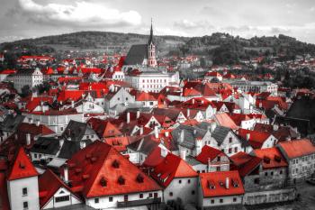 Black and white photo with the color red. View on Cesky Krumlov,Czech republic