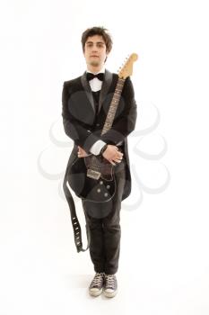 funny and charismatic guitarist in a suit with guitar
