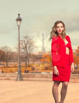 girl in red dress in Paris. against the background of the Eiffel Tower
