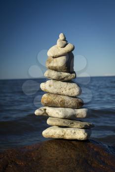 stones stacked on each other on the background of the ocean