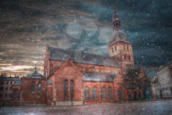 snow goes in winter. Riga Church of St. Peter and the streets of the ancient city