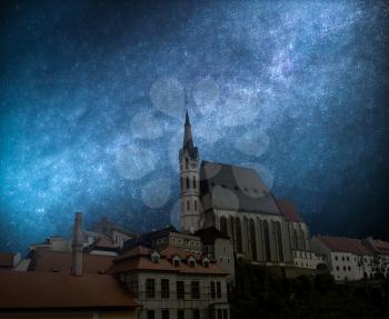 Chesky krumlov. Astrophotography, starry sky shines at night.
