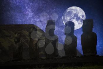 Moais at Ahu Tongariki (Easter island, Chile). night, the starry sky and the moon shine.