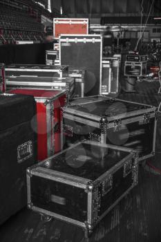 boxes for equipment. preparation for a concert. black and white photography.
