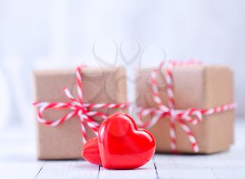 box for present and hearts on a table
