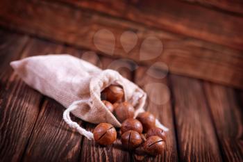 macadamia nuts in bag and on a table