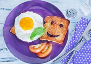 breakfast on plate, fried eggs and toasts
