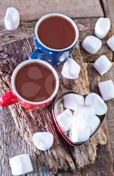 cocoa drink and marshmallows in the cups