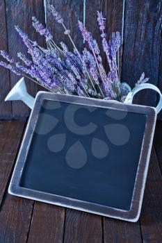 black board and fresh lavender on the wooden table