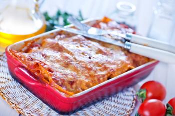 lasagna in bowl and on a table